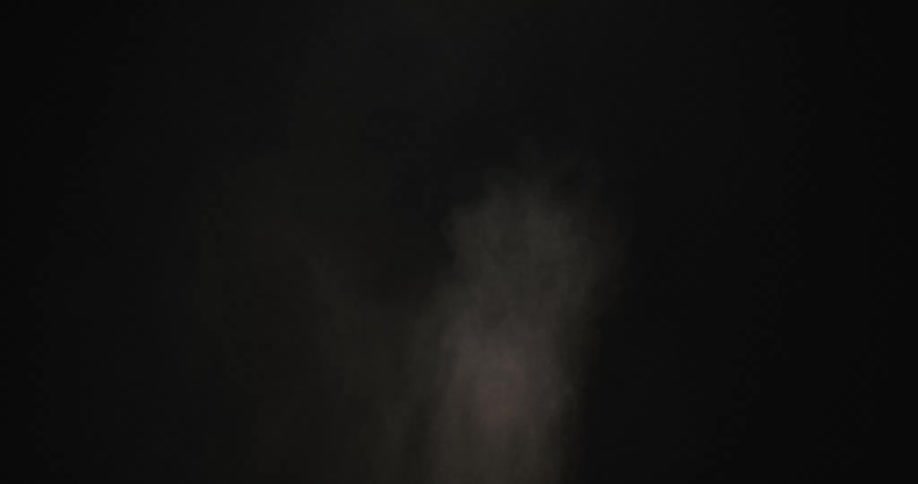 A dust cloud appears in the dark