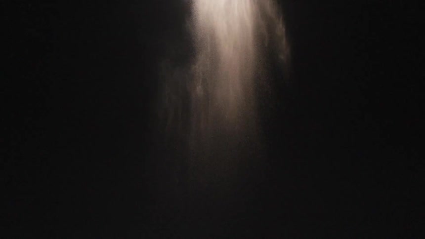 Dust slowly falls in the dark area
