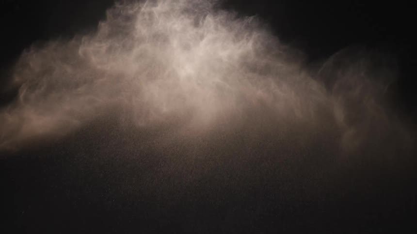 A view of sand flying through the air