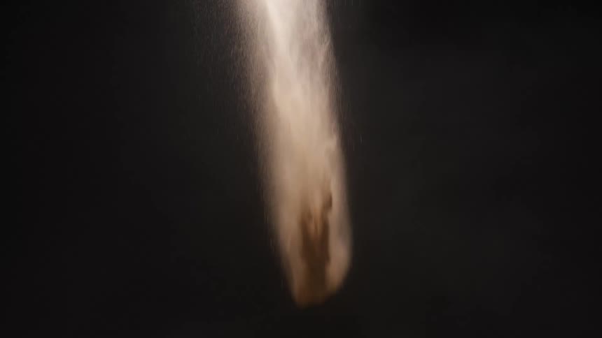 The dirt falls in the dark