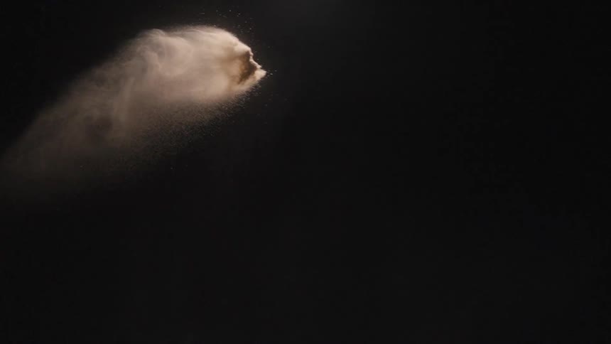 A view of sand flying through the air