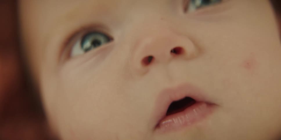 Close up of babys face looking around at their surroundings