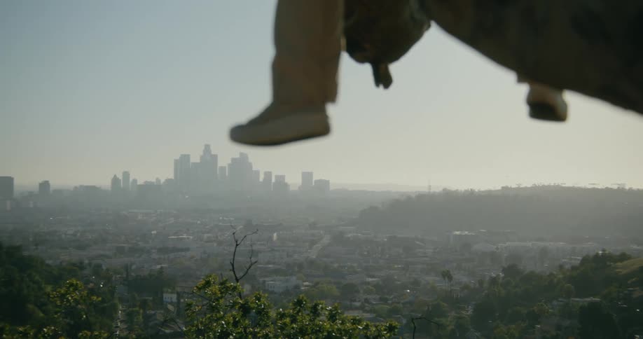 A person is perched on the cliff