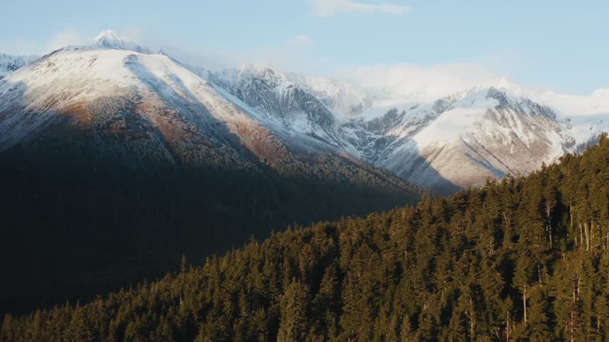 The mountains ahead are covered in snow