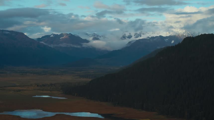 Puddles form in the valley between canyon peaks