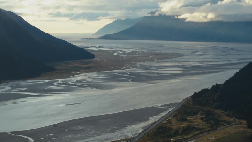 The river runs by the land