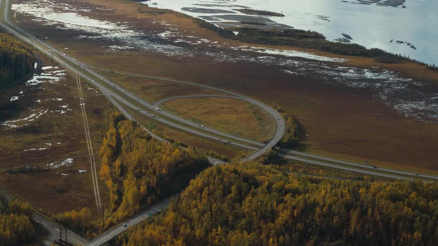 Cars travel on the winding highway