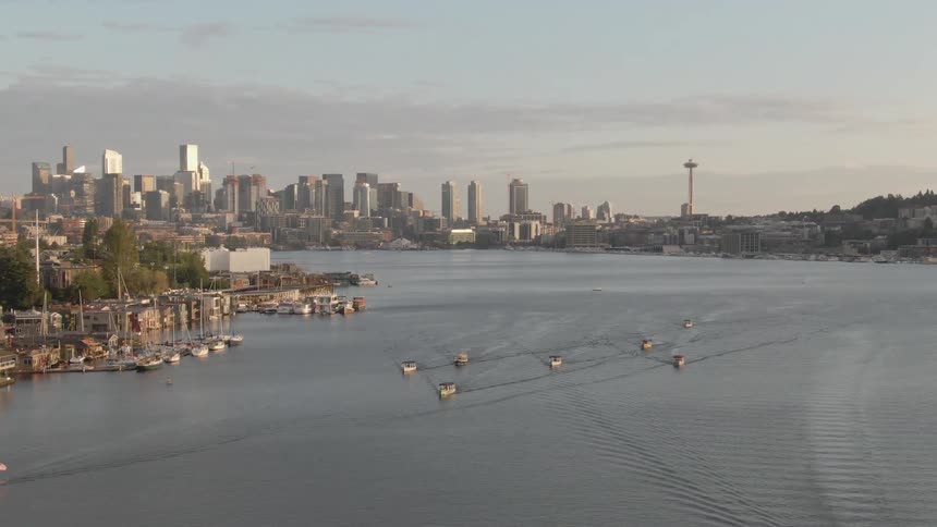 Boats sail away from the city