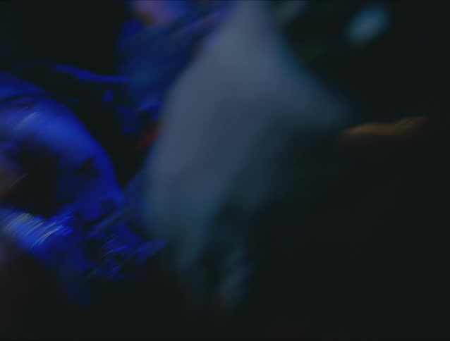 A man performs chest compressions on a woman with blood on her face neck and chest