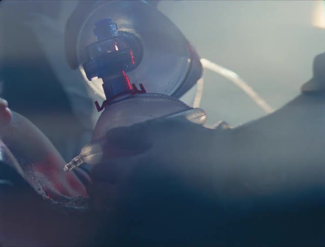 A view of a person having a mask put on