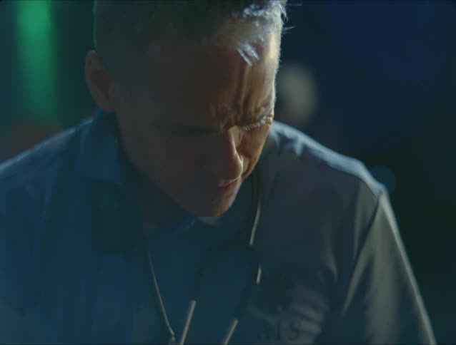 A male paramedic is responding to a scene