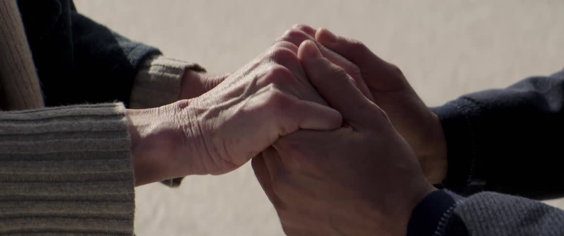 A man and woman are holding hands then they let go