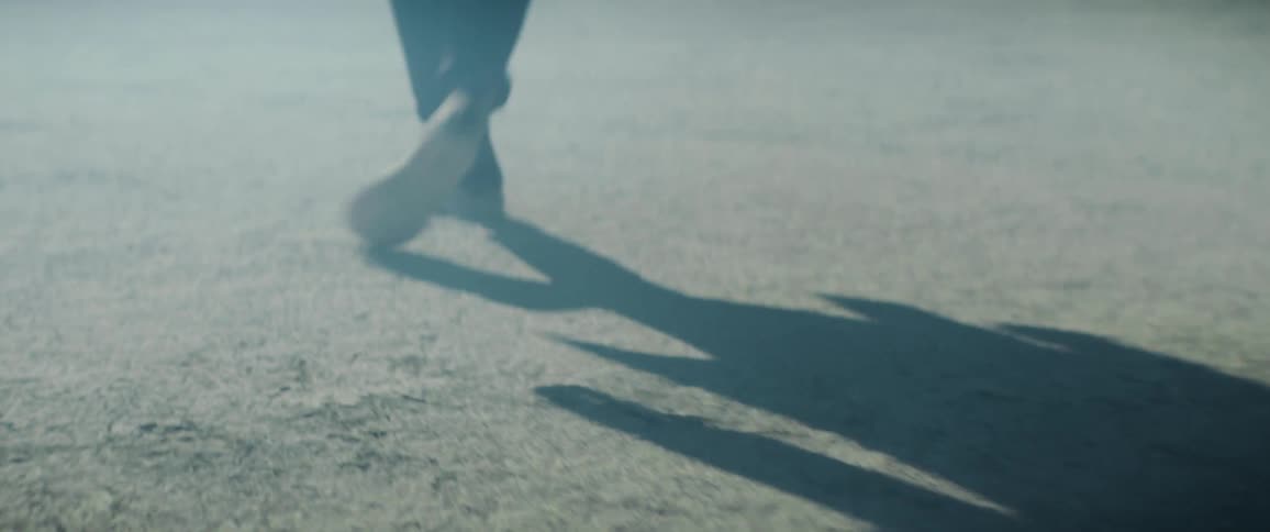 A person is walking in the desert