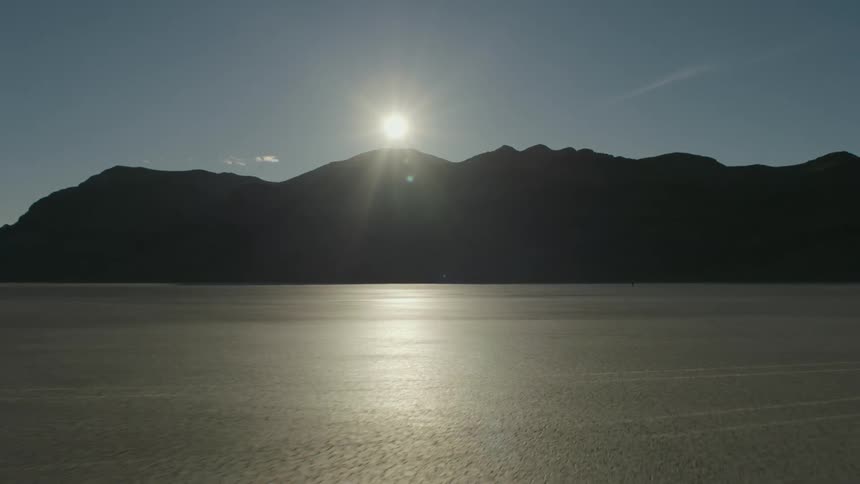 Landscape view of the sun over a desert area