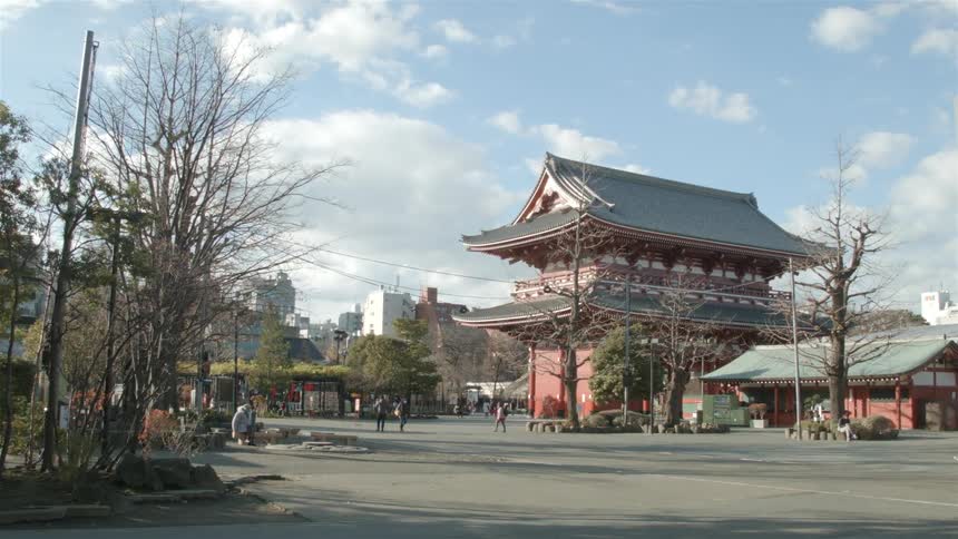 A city with people walking and biking around