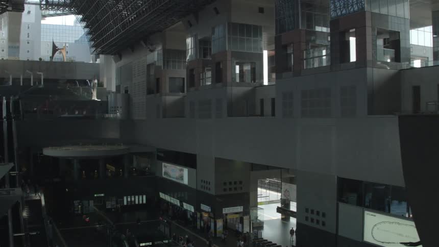 The inside of a station with people traveling below