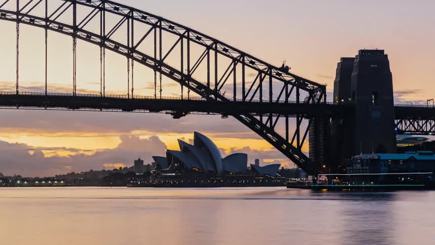 Boats floating in the sydney harbor at sunrise