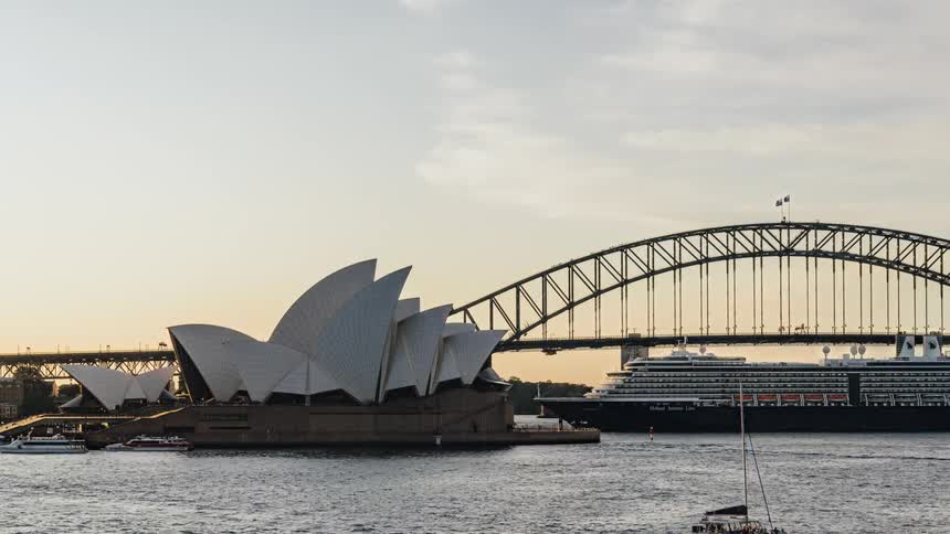 Boats sail past the sydney opera house