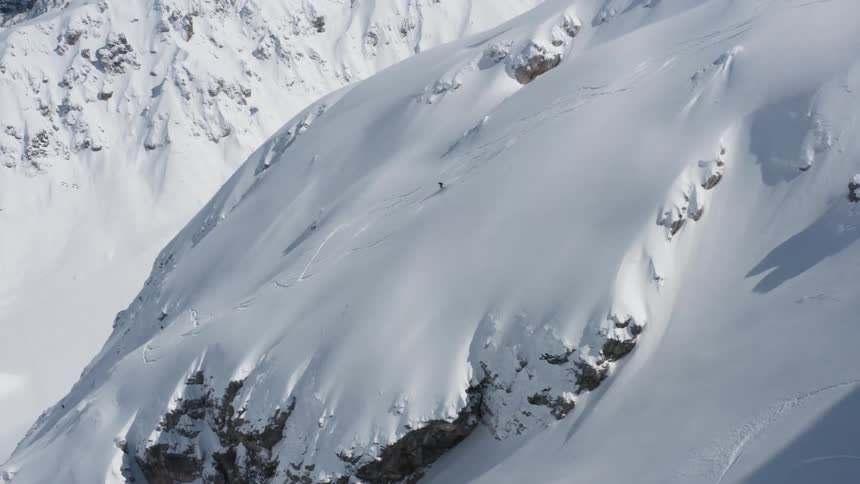 A person is skiing down the mountain