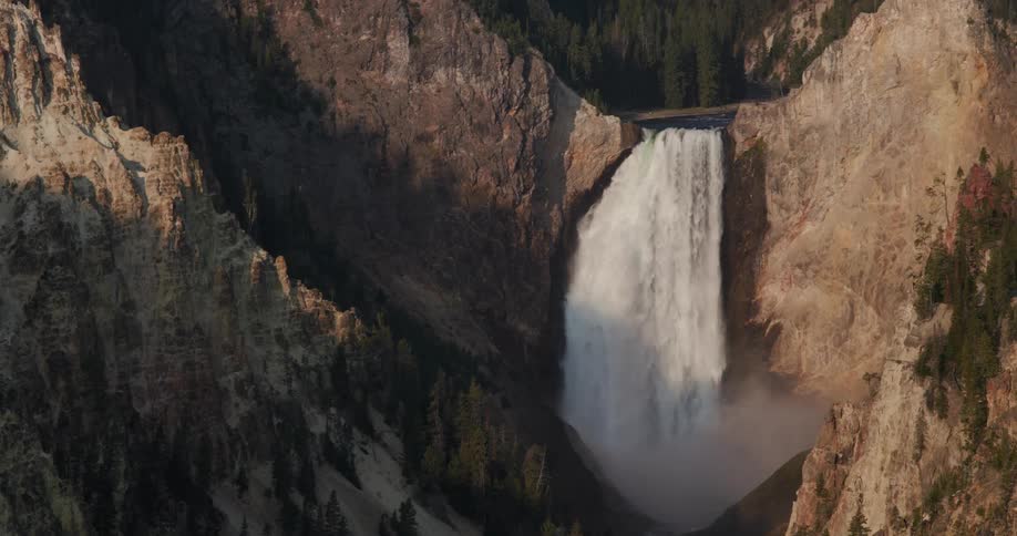 Aerial view of a water fall during the day time is displayed