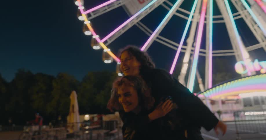 Two friends are hanging out at the carnival