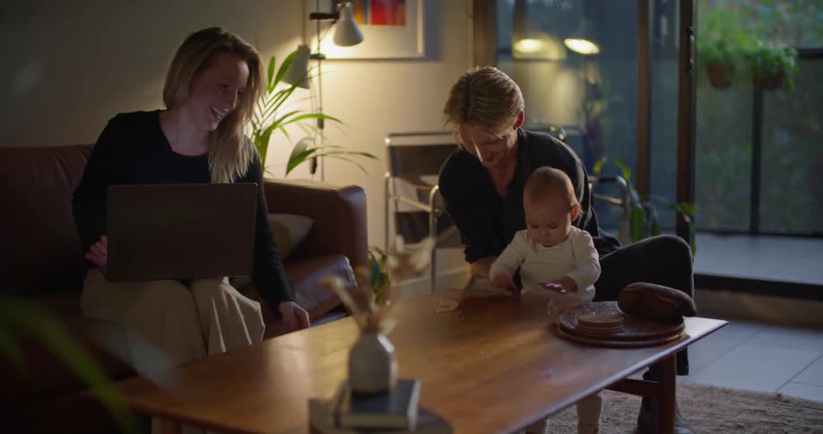 A family is hanging out together at night time