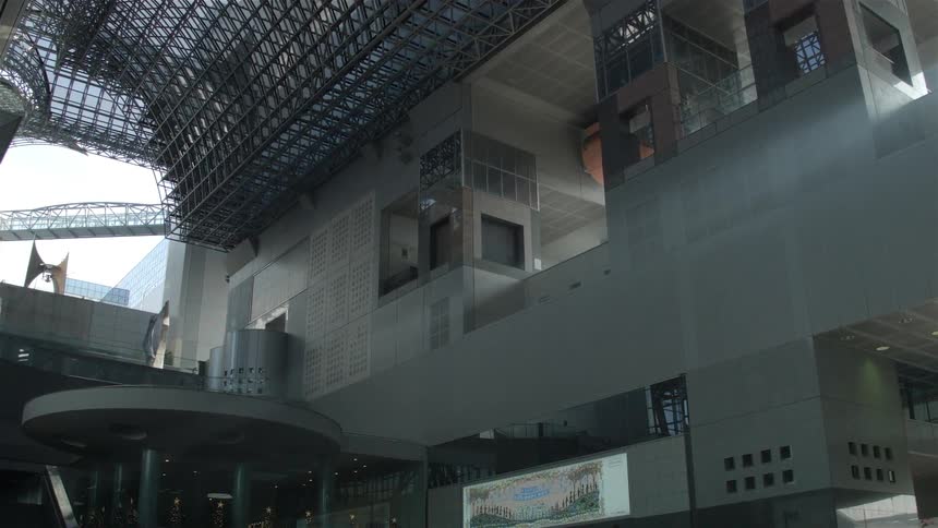 A hall has a high arched metal roof