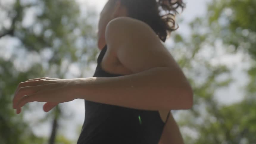 A woman is running in the woods