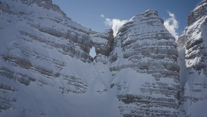 Aerial view of snow covered mountains are displayed