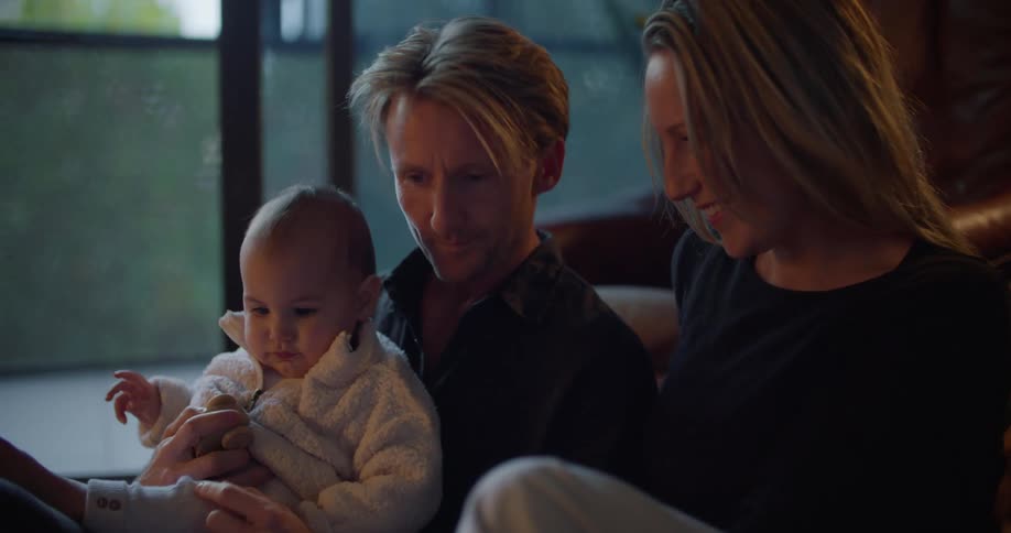 Parents are hanging out with their baby at home