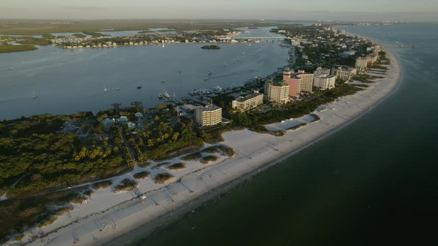 Aerial view of Fort Myers Beach near the ocean coast is displayed