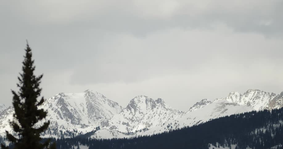 Aerial view of snow covered mountains are displayed
