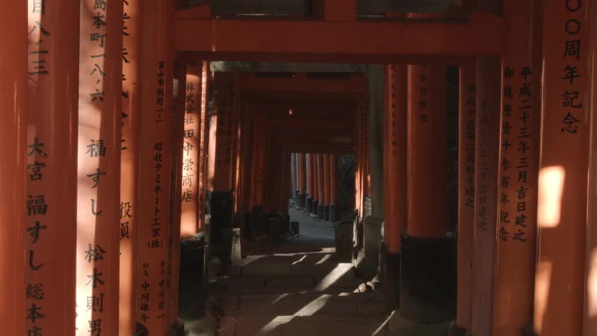 Chinese characters painted on streamers and poles in a long hallway