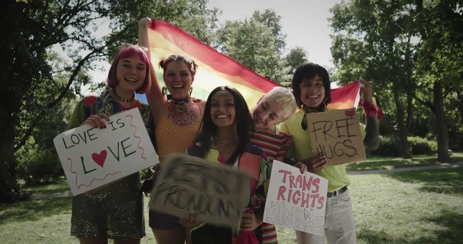 A group of women are protesting and holding up signs