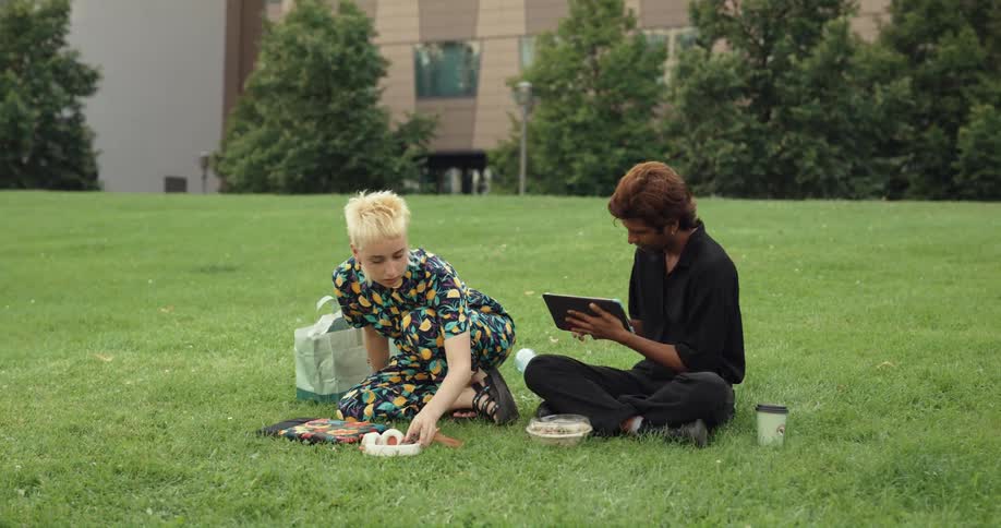A view of two people outdoors talking