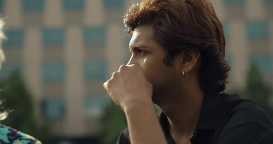 A man listens to a crying woman