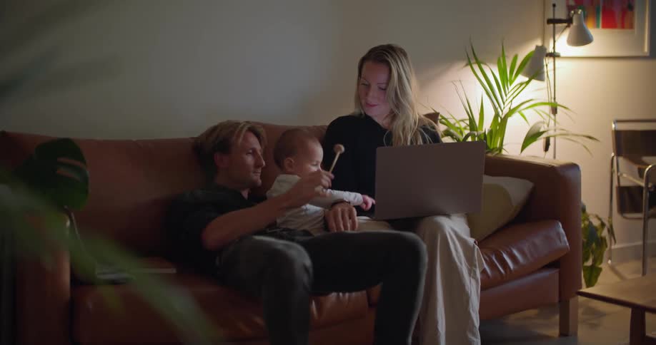 A family relaxing on the couch together