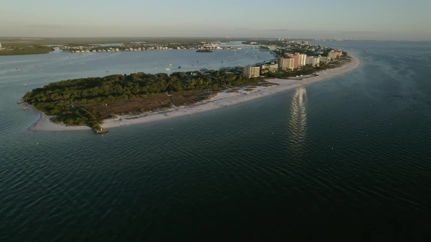 An aerial view of Fort Myers Beach coastal city at sunset
