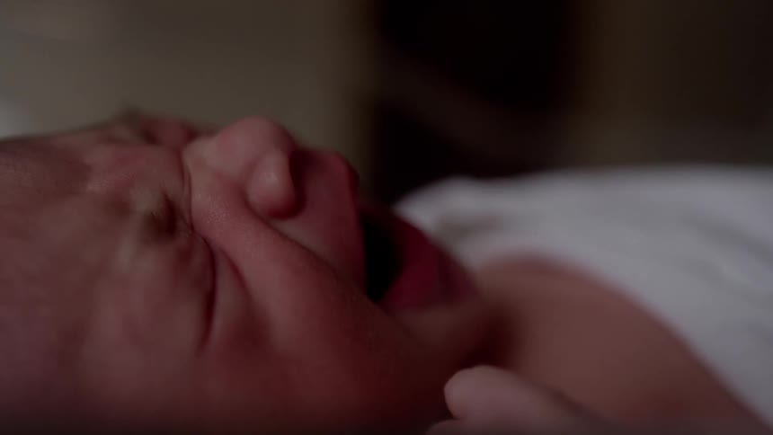 A crying and upset newborn baby