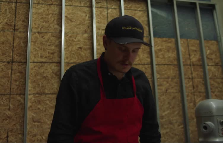An employee is working inside of a warehouse