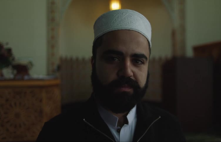 Islamic religious leader poses in place of worship
