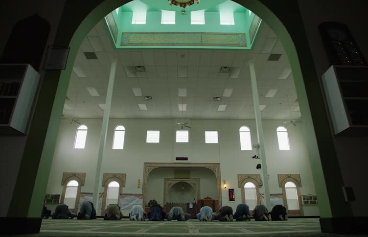 Muslim men pray at the mosque