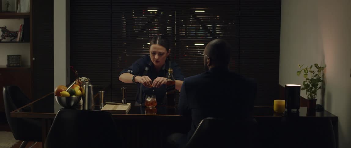 Two friends are hanging out drinking and eating
