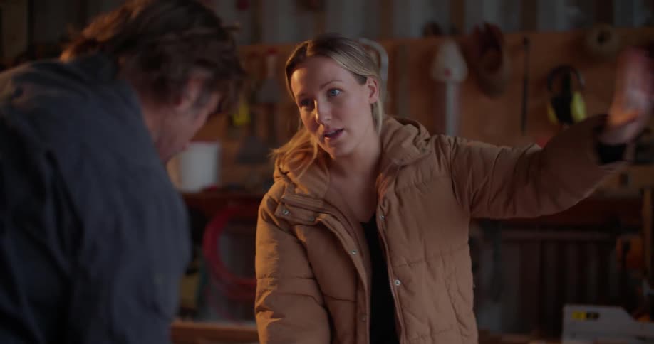Two people are talking to each other indoors
