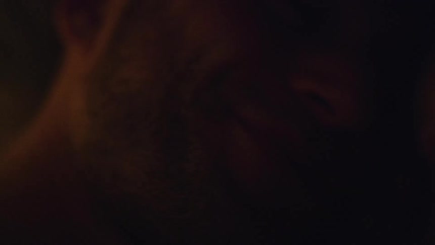 close up of man laying down smiling