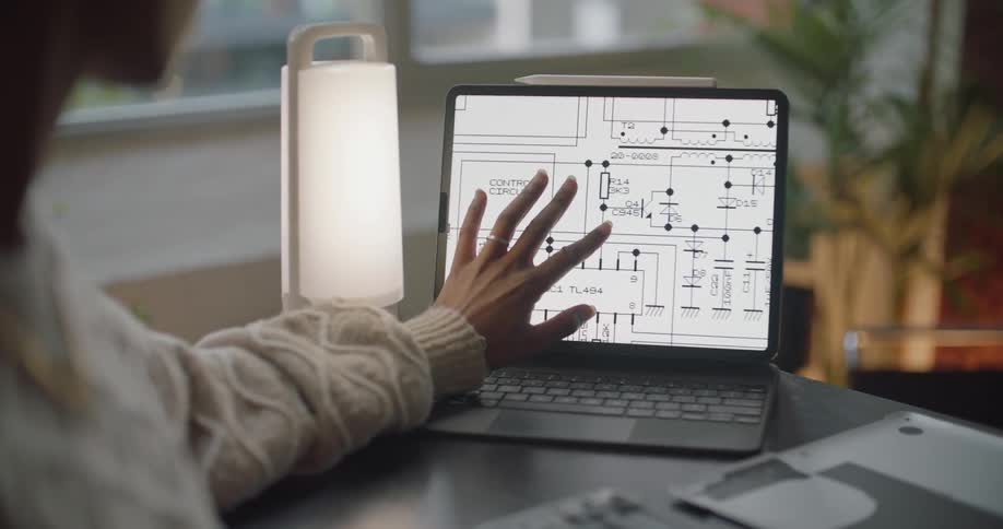 A person is looking at templates on a laptop