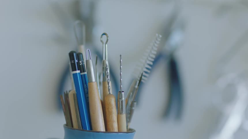 Artists tools are organized together in a cup