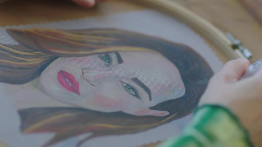 A female is sketching a picture of a female