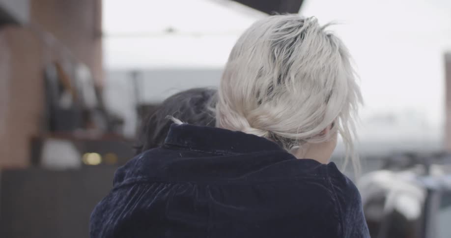 A woman is being carried by a man on his back
