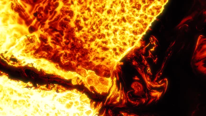 Yellow and red bright flames flow and converge over a black background